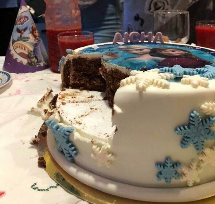 A cake with white frosting Description automatically generated with low confidence